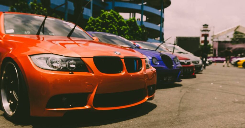 Cars for sale displayed on a parking lot.